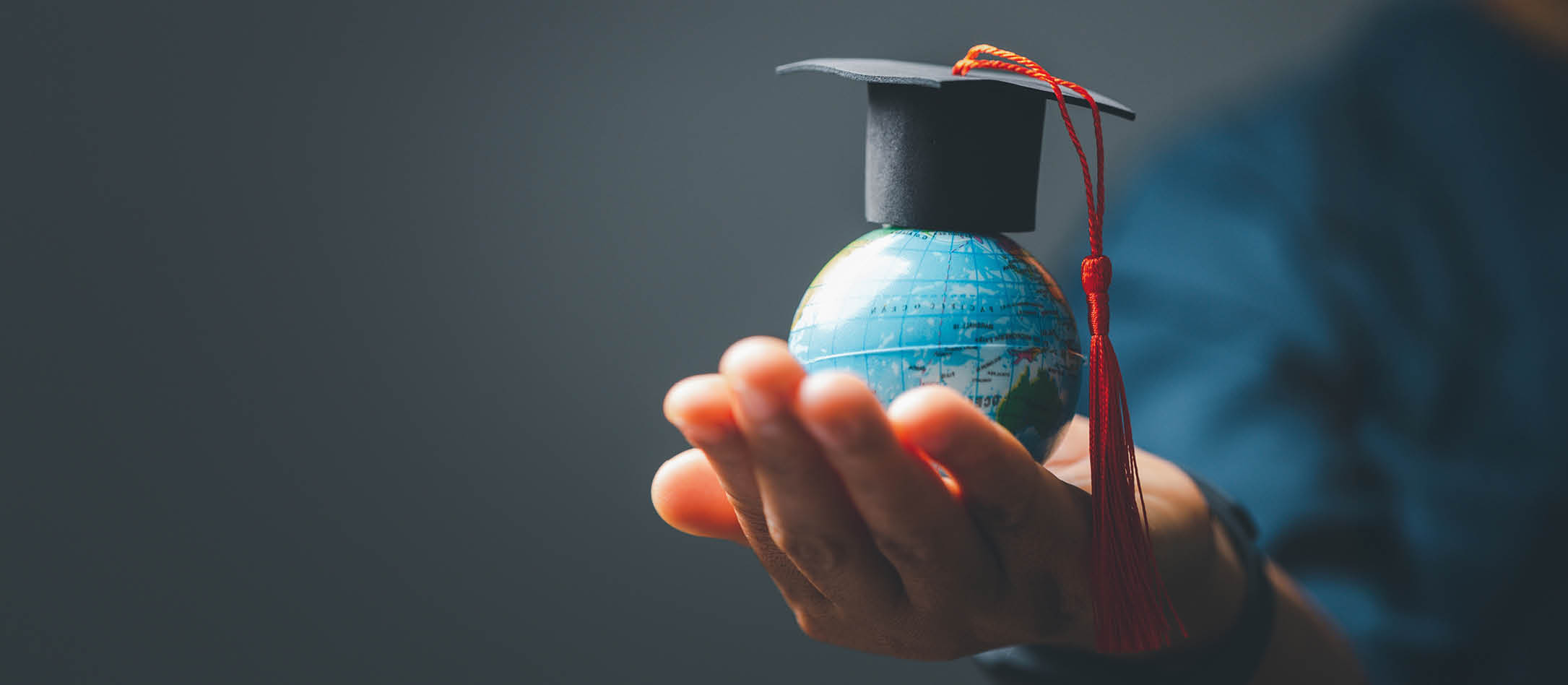 Graduation cap with Earth globe. Concept of global business study, abroad educational, Back to School. Education in Global world, Study abroad business in universities in worldwide. language study